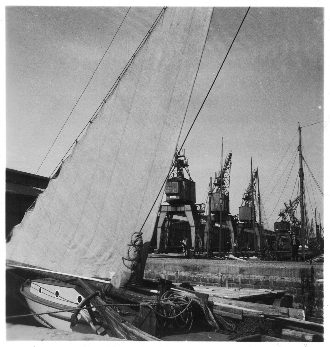 Sailing ship at the quay in Tallinn harbour, with port cranes behind, photographed in 1937